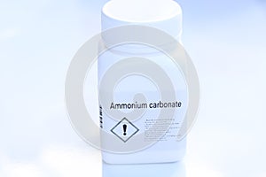 Ammonium carbonate in bottle , chemical in the laboratory and industry