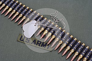ammunition belt and dog tags on US ARMY uniform