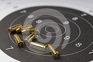 Ammunition and bullets on paper target for shooting practice