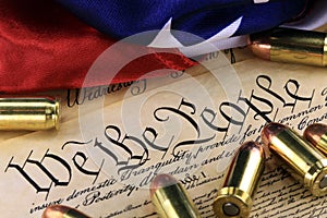 Ammunition and flag on US Constitution - History of the Second Amendment photo