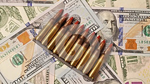 Ammunition from the gun on money bills. Bullets on dollars money, background. Lend-Lease concept. Army concept