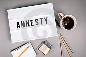 Amnesty. Text in light box photo