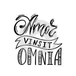 Amor Vinsit Omnia - latin phrase means Love Conquers All. Hand drawn inspirational vector quote for prints, posters, t-shirts. photo