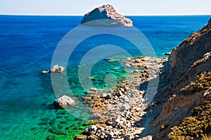 Rocky beach on Amorgos coastline photo