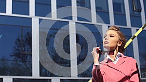 Amorous girl in the big city. Woman is waiting for a colleague