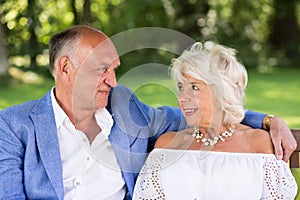 Amorous senior couple in park