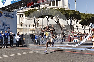 Amos Kipruto crosses the finish line