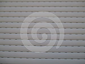 Window shutters with slits for light photo