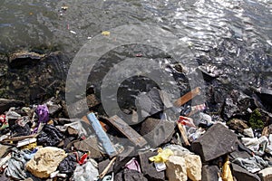 Amount of trash polluting river water photo