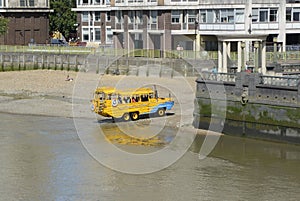 Amphibious tourist bus on River Thames. London UK