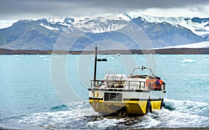 Amphibious vehicle in Jokulsarlon glacier lagoon - Iceland photo
