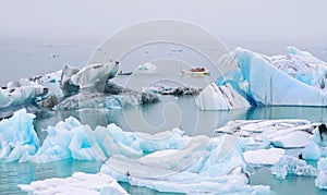 Amphibious vehicle takes tourists on iceberg watching tour in Jokulsarlon lagoon