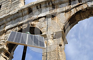 Amphitheater in Pula, Croatia with in front solar photo
