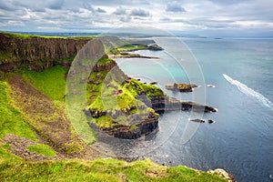 The Amphitheatre, Port Reostan Bay and Giant's Causeway on background, County Antrim, Northern Ireland, UK