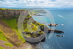 The Amphitheatre, Port Reostan Bay and Giant`s Causeway on background, County Antrim, Northern Ireland, UK