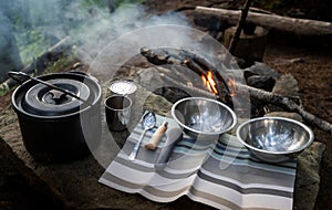 Ð¡amping food cooking outdoor on fire in a cauldron