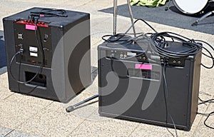 Amplifiers outdoor next to a drum