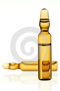 Ampoule containing yellow drug photo