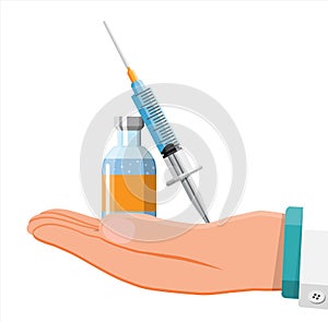 Ampoule and syringe in hand