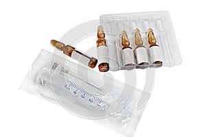 Ampoules with medicine and syringe