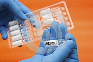 Ampoules vaccine flu - search vaccine, lettering sars-cov-2, coronavirus, covid19