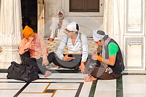 Amritsar, India - November 21, 2011: The Sikh pilgrims in the Golden Temple complex. Amritsar, Punjab, India