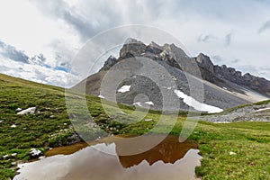 Amselfluh mountain between Arosa and Davos with cloudy sky