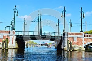 Amstel river, bridge, boats, Netherlands, Europe and colorful buildings