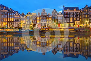 Amstel river, canals and night view of beautiful Amsterdam city. Netherlands