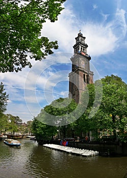 Amstel river and Westerkerk church in Amsterdam.