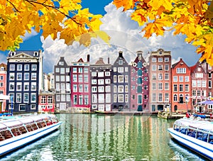 Amsterdam architecture at Damrak canal in autumn, Netherlands