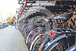 amsterdam and bicycles parked on the roadside
