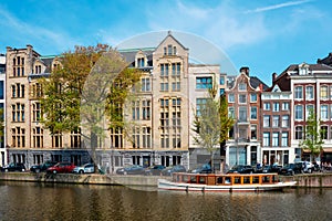 Amsterdam bridge over canal with houses