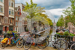 Amsterdam canal and bridge with bikes, Holland