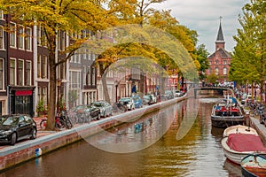 Amsterdam canal, church and typical houses