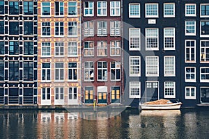 Amsterdam canal Damrak with houses, Netherlands