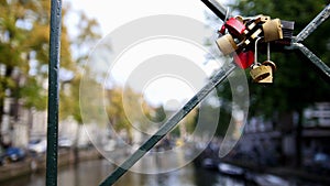 Amsterdam canal, Holland, Netherlands - view from bridge, wedding locks