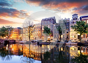 Amsterdam Canal houses at sunset reflections, Netherlands