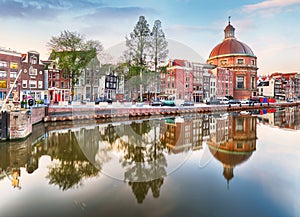 Amsterdam Canal houses at sunset reflections, Netherlands