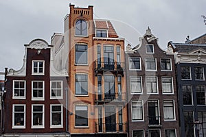 Amsterdam canal houses and their reflections in the water