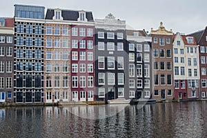 Amsterdam canal houses and their reflections in the water