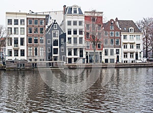 Amsterdam canal houses and their reflections in the water