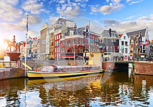 Amsterdam canal Netherlands. Traditional houses and bridge