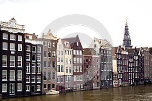 Amsterdam canal scene with old buildings and boat