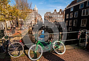 Amsterdam canal view and bicycles on the bridge