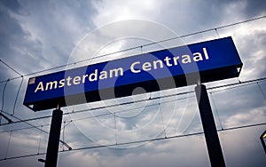 Amsterdam Central station sign post on the train station platform