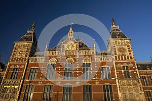 amsterdam central station at sunset