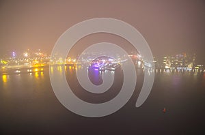 Amsterdam cityscape and beautiful mystic view from top at foggy night