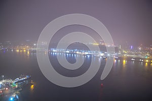 Amsterdam cityscape and beautiful mystic view from top at foggy night.