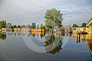 Amsterdam floating houses in river Amstel channel